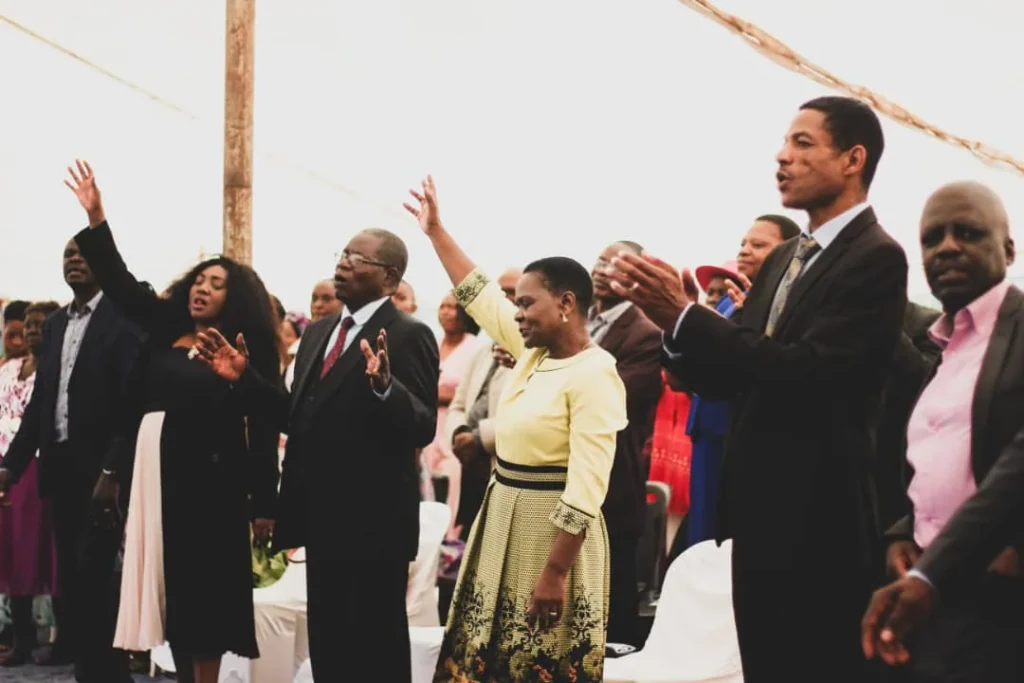 Throne Room Church members raising their hands and clapping in worship