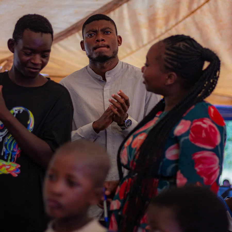 Young people singing and worshipping together